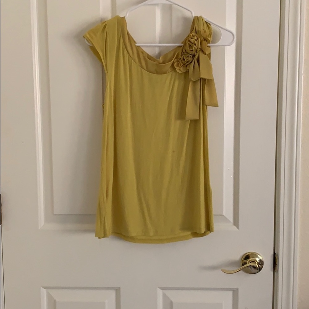 Yellowish green floral top.